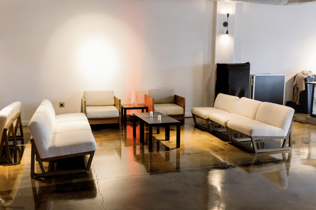 Lounge area with couches and other soft seating, and a coffee table. Perfect space for a celebration of life.